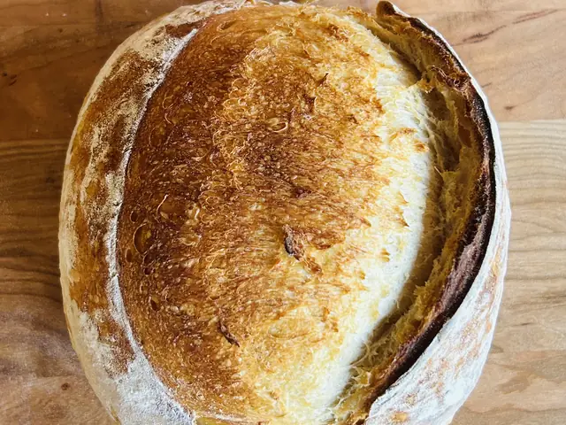 Classic organic sourdough loaf with a golden, crackly crust